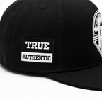 True Authentic Signature Snapback Hat – Black/White Embroidered Logo