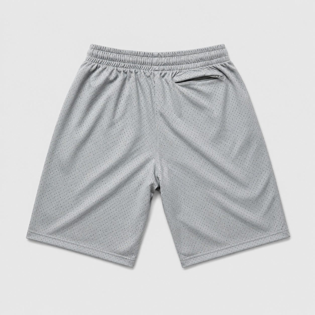 Light gray athletic mesh shorts with an elastic waistband, photographed flat against a light gray background.