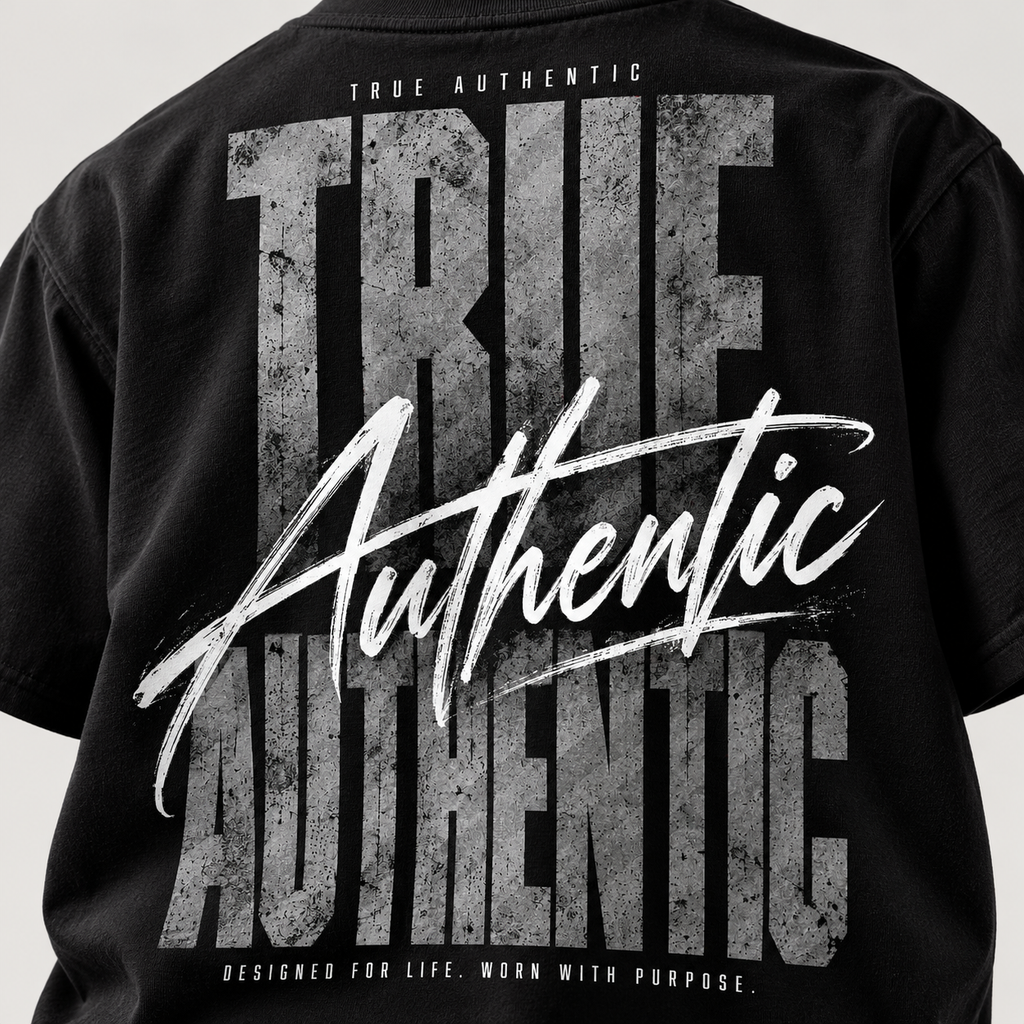 TRUE AUTHENTIC authentic script black cotton graphic tee — oversized back artwork, close-up