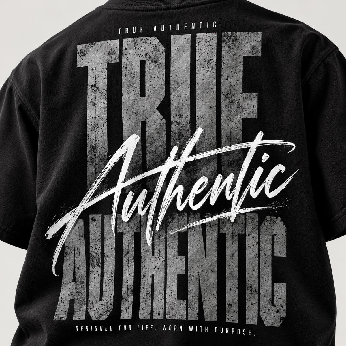 TRUE AUTHENTIC authentic script black cotton graphic tee — oversized back artwork, close-up