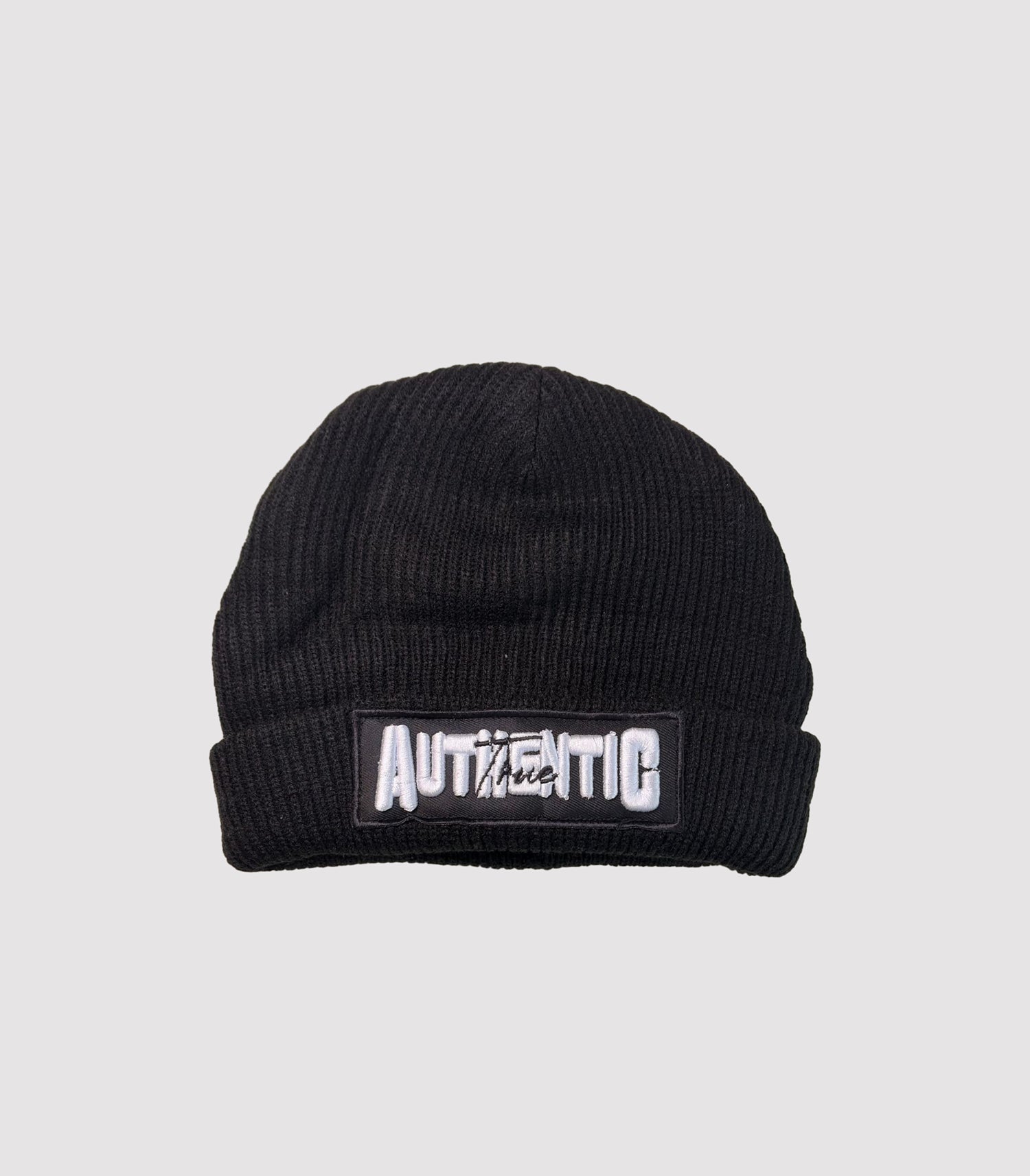 Black beanie with 'Authentic' patch on a light gray background