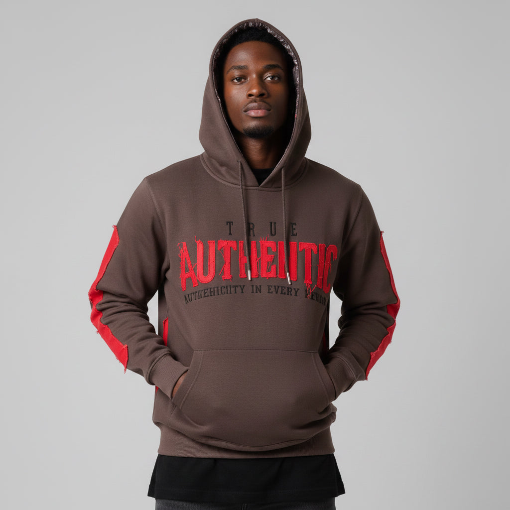 Person wearing a brown hoodie with red accents and text on a gray background