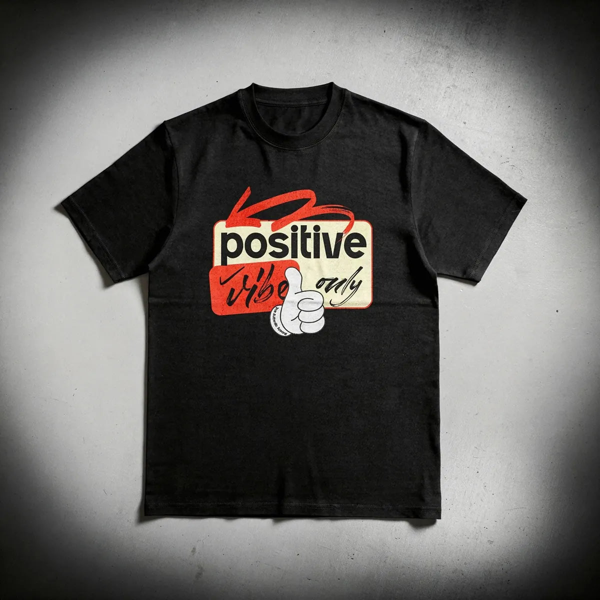 Black t-shirt with a graphic design on a gray background