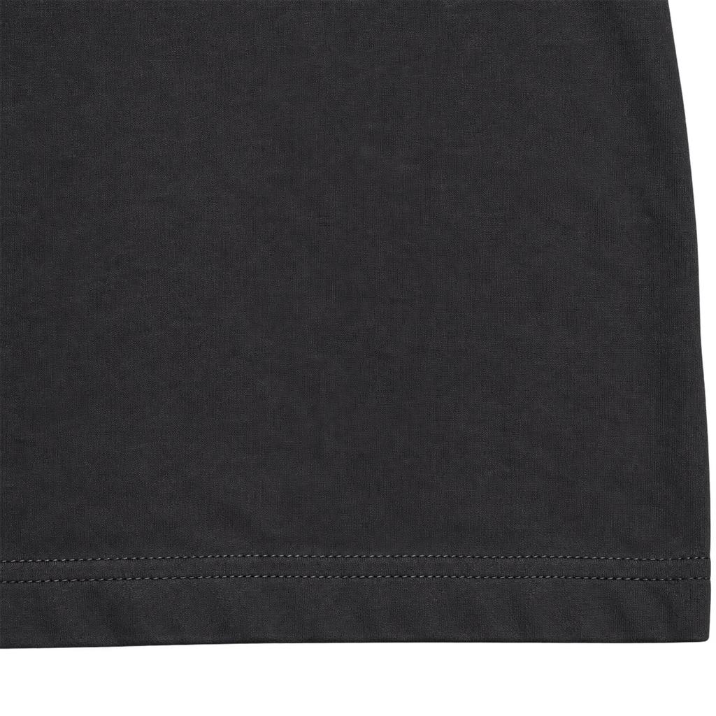 Black heavyweight cotton T-shirt fabric texture and reinforced hem detail