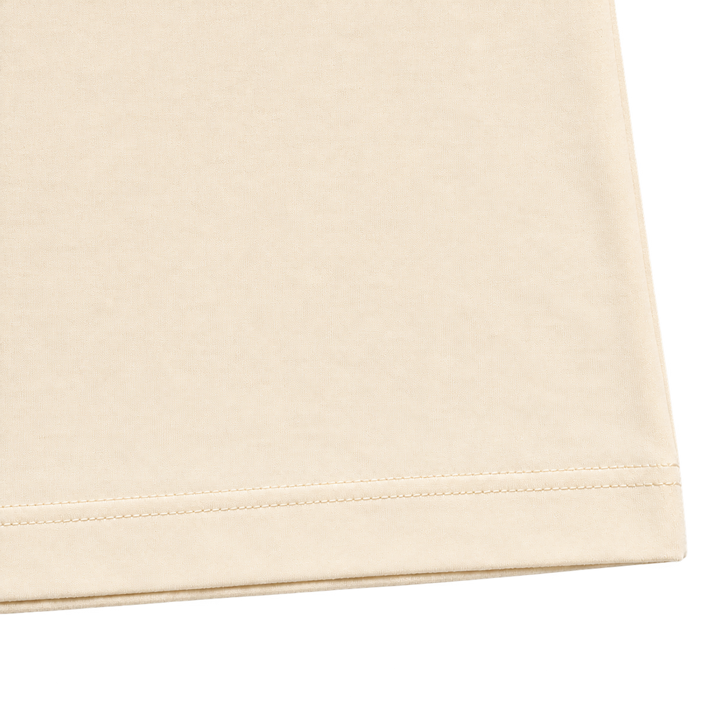 Cream 300GSM cotton T-shirt fabric texture and double stitched hem detail