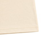 Cream 300GSM cotton T-shirt fabric texture and double stitched hem detail