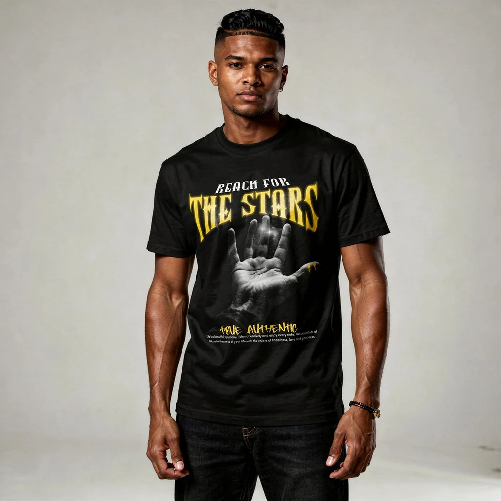Man wearing a black t-shirt with 'Reach for the Stars' text and graphic design.