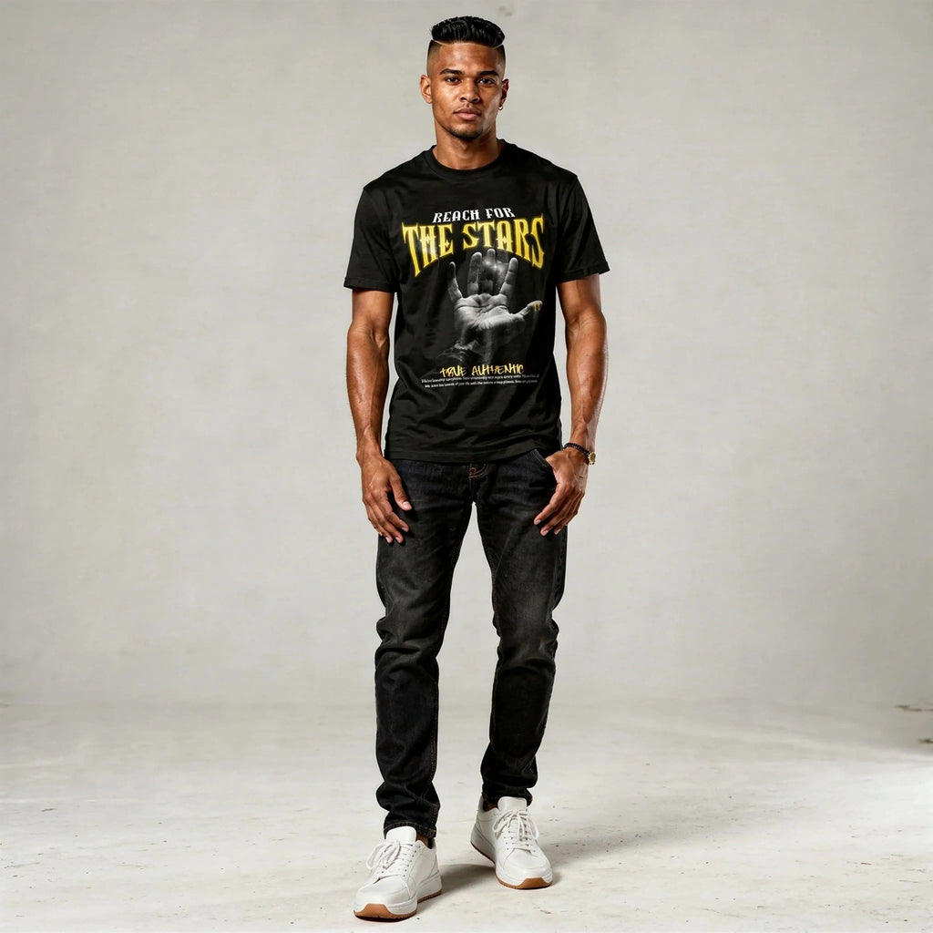 Man wearing a black t-shirt with graphic design and text, standing against a plain background