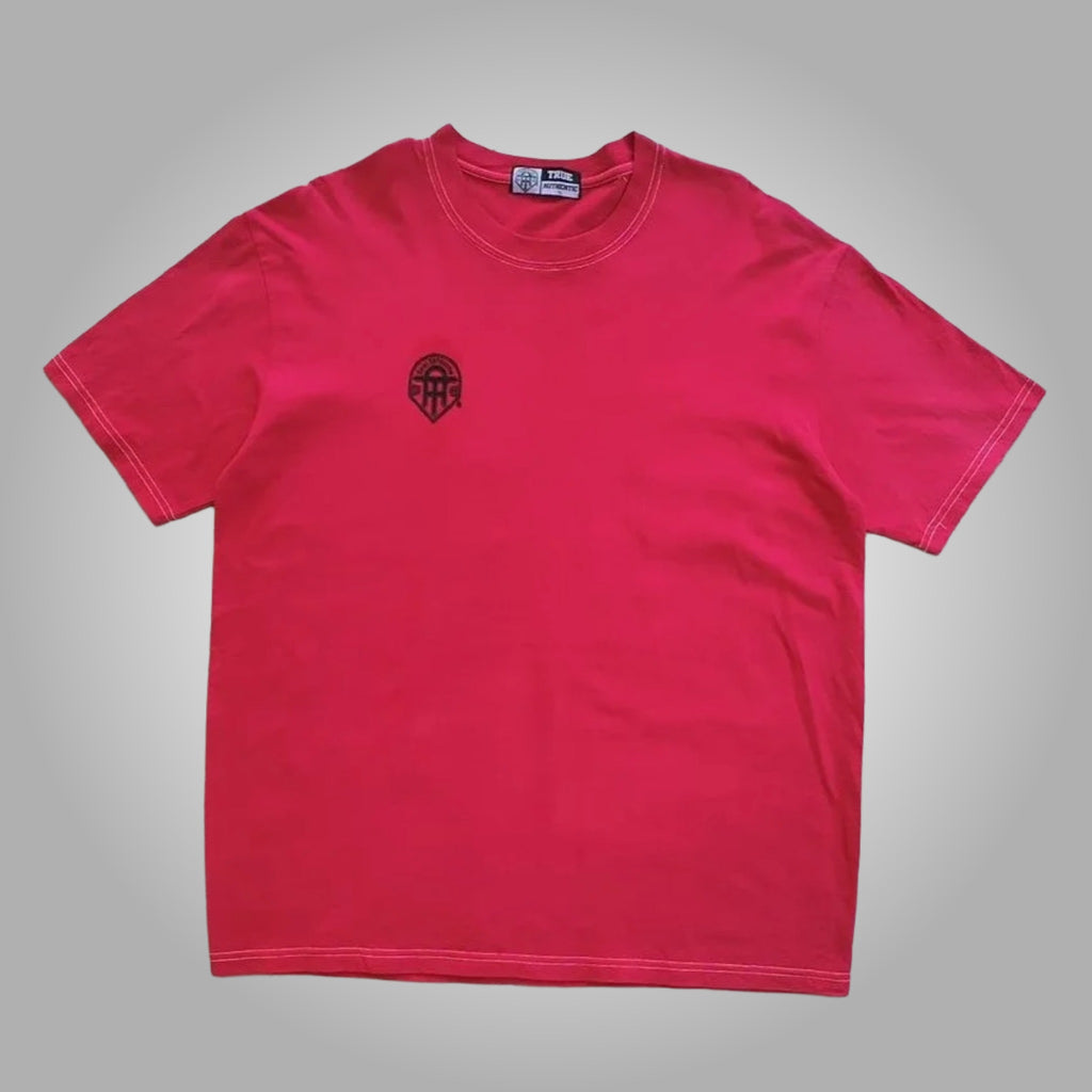 Flat lay of a vibrant red True Authentic regular fit men's t-shirt with a small black embroidered logo on the chest.