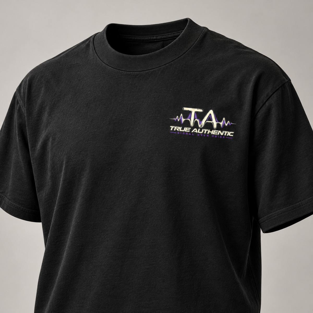 TRUE AUTHENTIC signal over noise black cotton graphic tee — small left chest logo, close-up