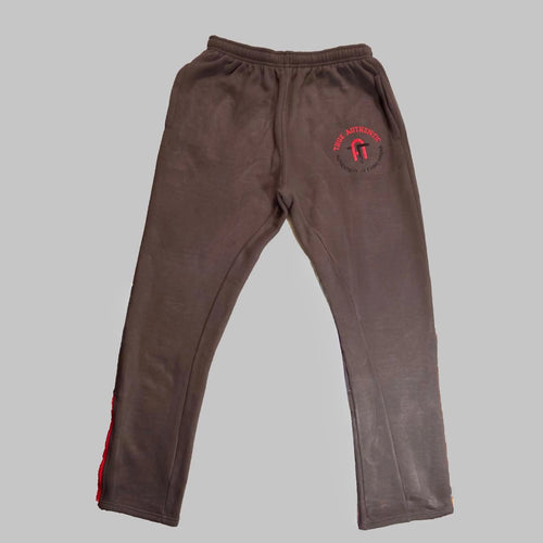 Brown sweatpants with a red logo on a gray background