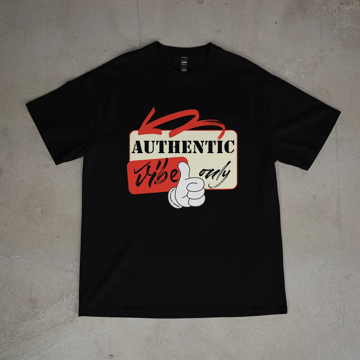 Black t-shirt with 'Authentic vibe only' graphic on a beige surface